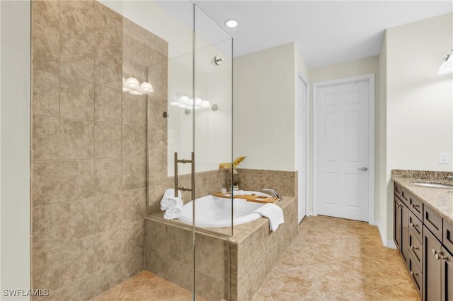 bathroom featuring vanity, tile patterned floors, and plus walk in shower