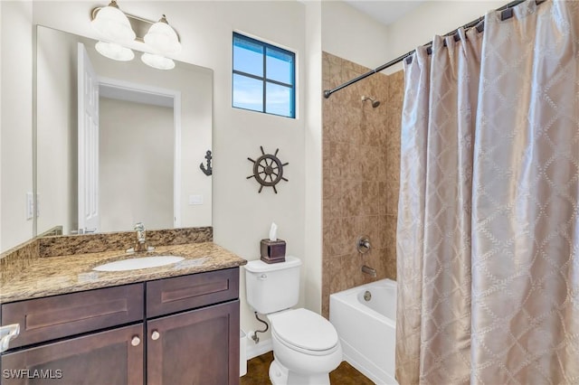 full bathroom with vanity, shower / bath combo, and toilet