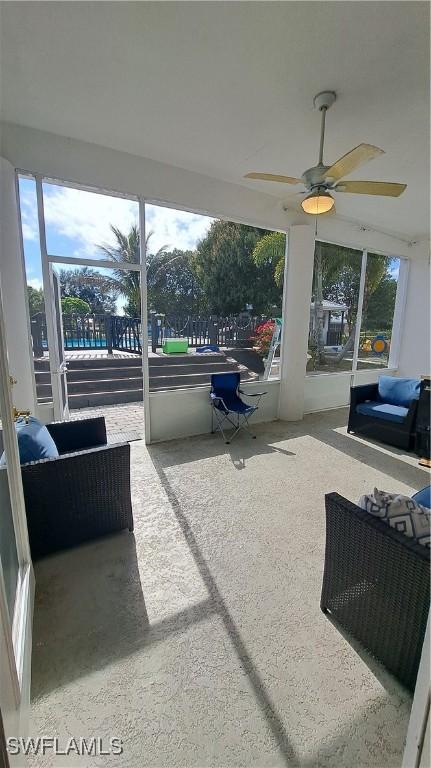 sunroom / solarium with ceiling fan