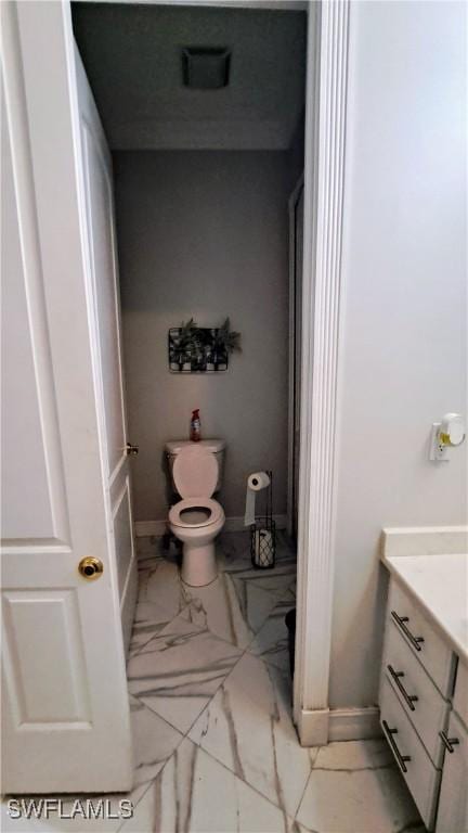 bathroom featuring vanity and toilet