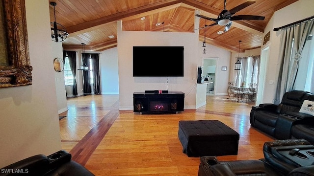 living room with lofted ceiling with beams, wooden ceiling, ceiling fan with notable chandelier, and light hardwood / wood-style flooring