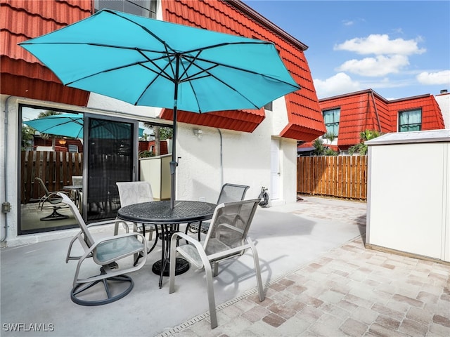 view of patio with a shed