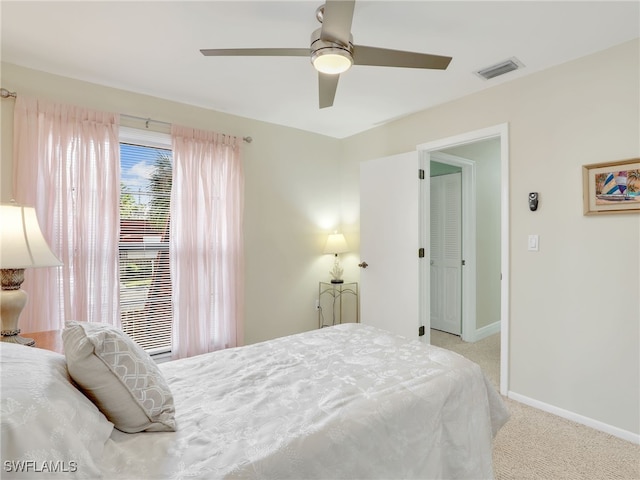 carpeted bedroom with ceiling fan