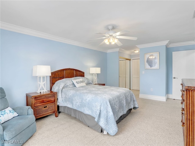 bedroom featuring a closet, light colored carpet, ceiling fan, and ornamental molding