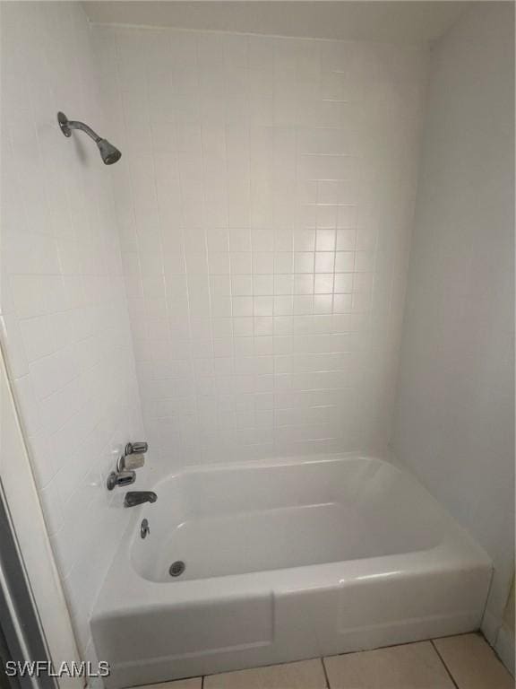 bathroom featuring tile patterned floors and tub / shower combination