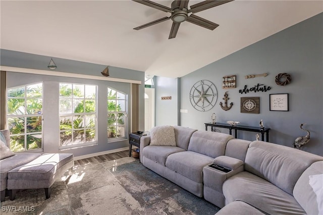 living room featuring ceiling fan, hardwood / wood-style floors, and vaulted ceiling