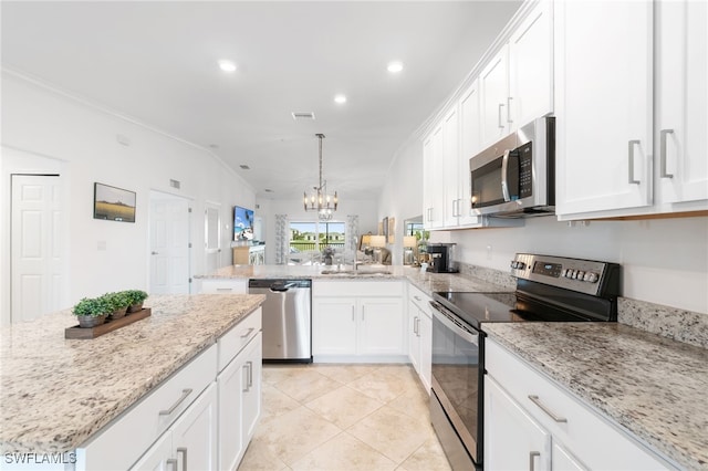 kitchen featuring kitchen peninsula, stainless steel appliances, white cabinetry, and lofted ceiling