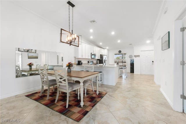 tiled dining area featuring ornamental molding