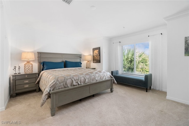 carpeted bedroom featuring crown molding