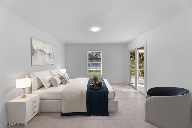 tiled bedroom featuring access to exterior