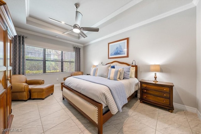 bedroom with ceiling fan, light tile patterned floors, crown molding, and a tray ceiling