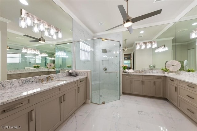 bathroom featuring ceiling fan, vanity, a healthy amount of sunlight, and an enclosed shower