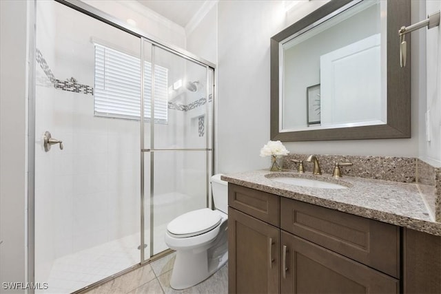 bathroom featuring an enclosed shower, vanity, crown molding, tile patterned flooring, and toilet