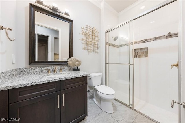 bathroom with vanity, toilet, an enclosed shower, and crown molding