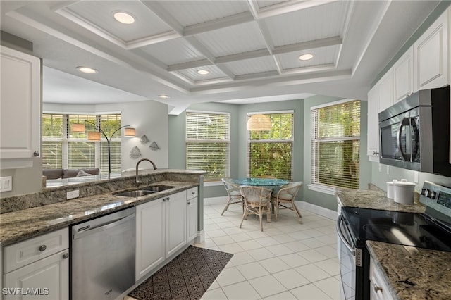 kitchen featuring sink, white cabinets, and appliances with stainless steel finishes