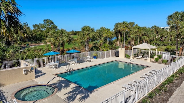 view of pool featuring a gazebo, a patio area, and a community hot tub