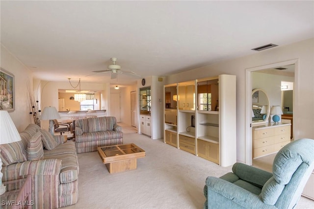 living room featuring ceiling fan and light carpet