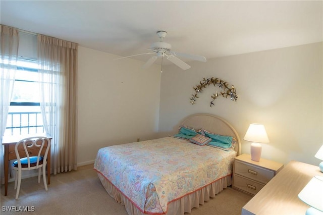 bedroom with light colored carpet and ceiling fan