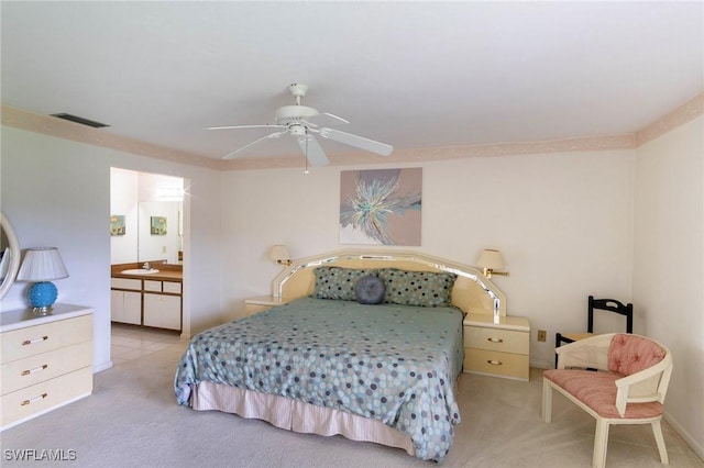 carpeted bedroom featuring ceiling fan and sink