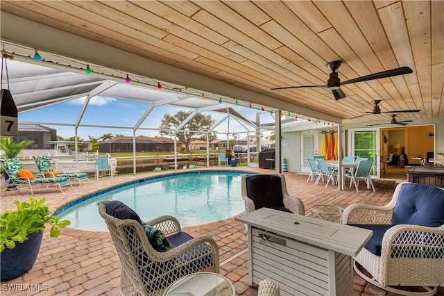 view of pool with a lanai and a patio area