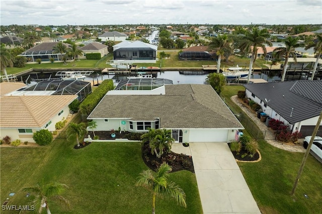 birds eye view of property with a water view