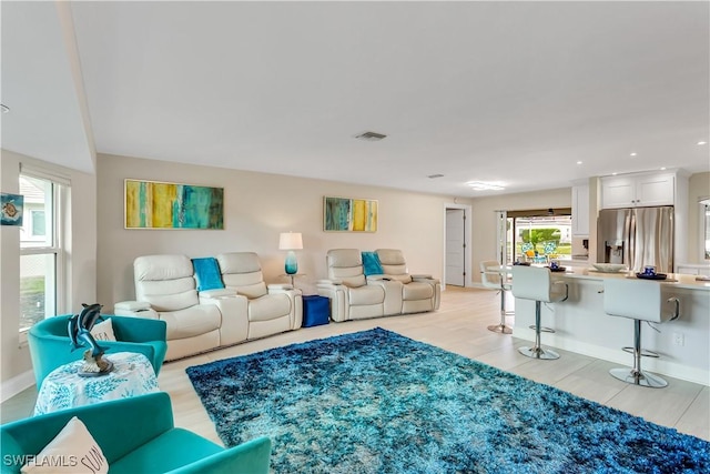 living room with light hardwood / wood-style floors