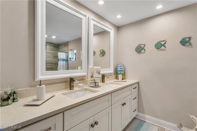 bathroom with a shower with curtain and vanity