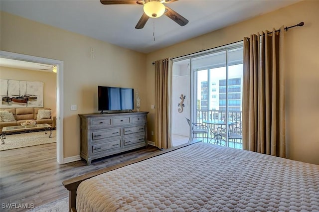 bedroom featuring ceiling fan, wood-type flooring, and access to outside