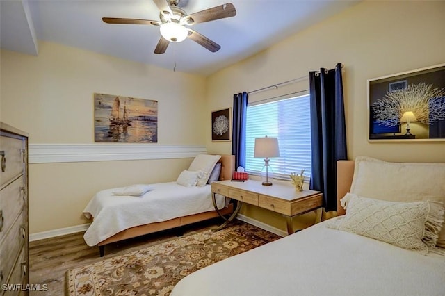 bedroom with hardwood / wood-style floors and ceiling fan