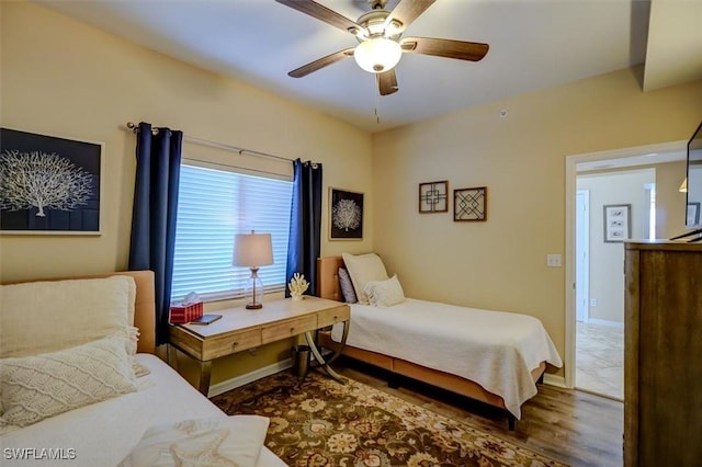 bedroom with ceiling fan and wood-type flooring