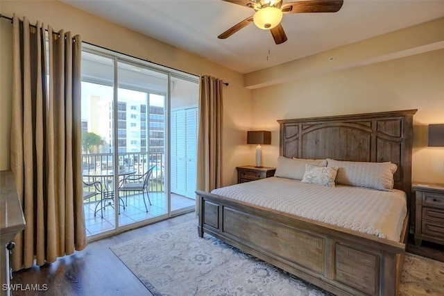 bedroom featuring access to exterior, hardwood / wood-style floors, and ceiling fan