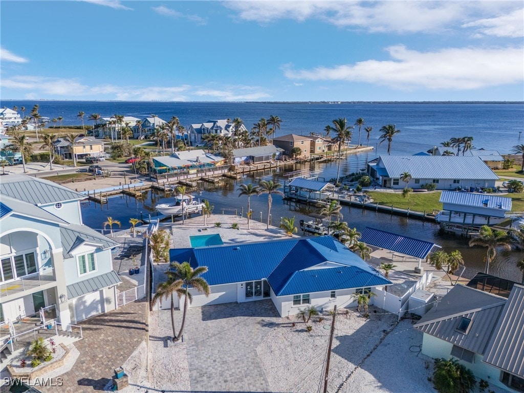 birds eye view of property with a water view