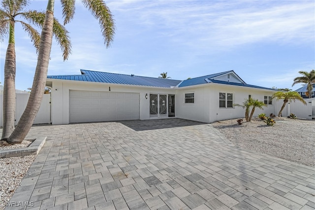 ranch-style home featuring a garage