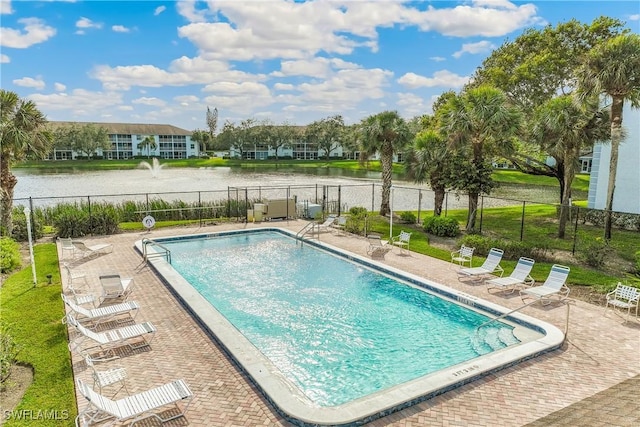 9610 Victoria Ln Unit 208D, Naples, FL 34109 - community pool with fence, a water view, and a patio area