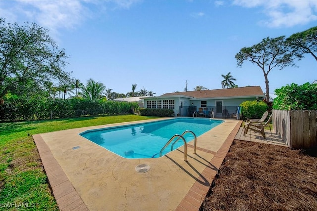 view of pool featuring a fenced backyard, a lawn, a fenced in pool, and a patio