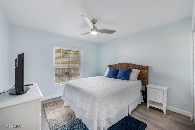 bedroom with hardwood / wood-style flooring and ceiling fan