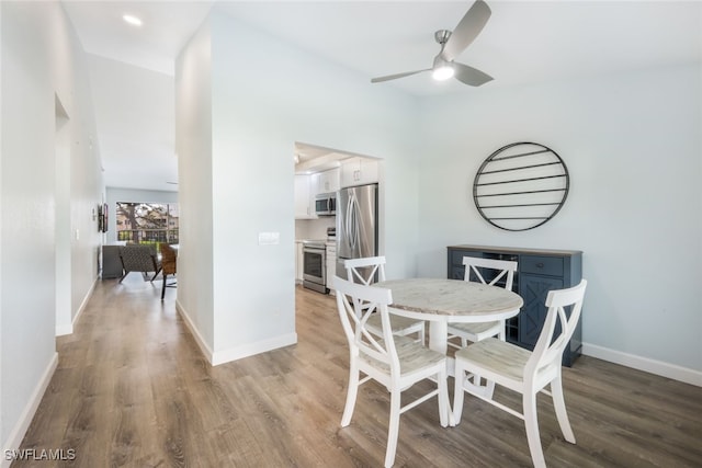 dining area featuring ceiling fan and light hardwood / wood-style floors