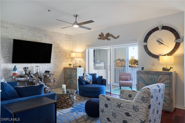 living room with ceiling fan and hardwood / wood-style floors