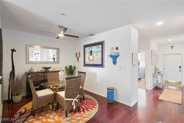 dining room with dark hardwood / wood-style floors and ceiling fan