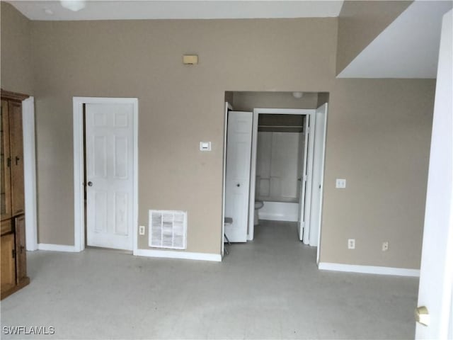 unfurnished bedroom featuring ensuite bath