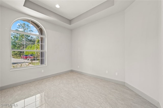 empty room with a tray ceiling