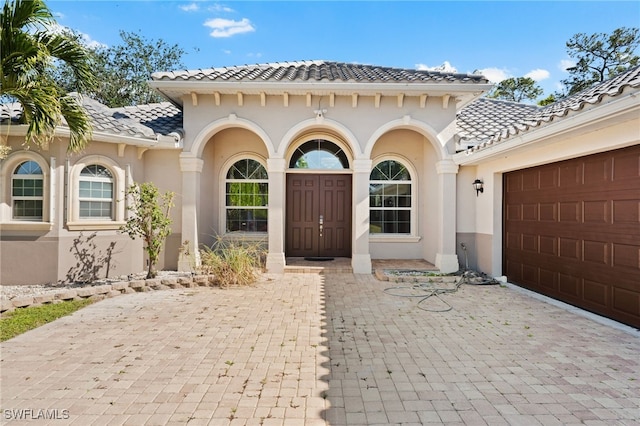 property entrance featuring a garage