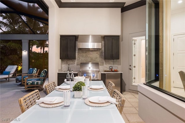 tiled dining room featuring crown molding