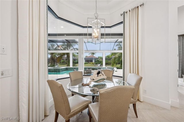 tiled dining room featuring crown molding