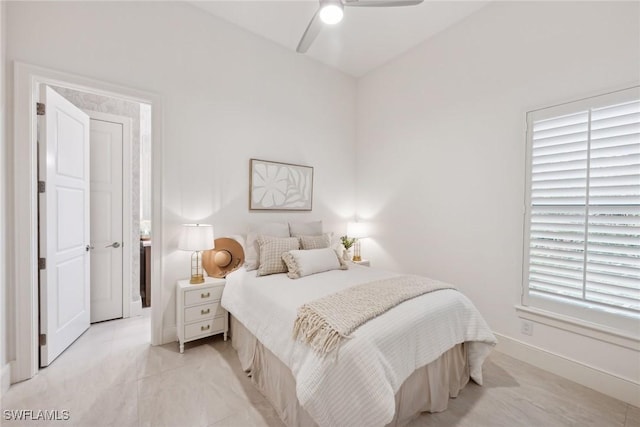 bedroom with multiple windows and ceiling fan