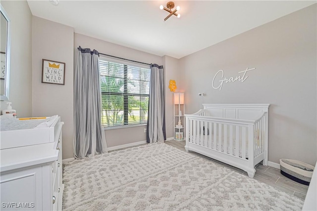 bedroom with a nursery area