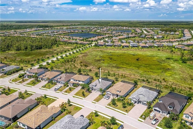 drone / aerial view with a water view