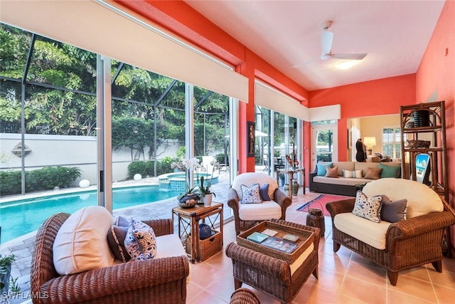 sunroom / solarium featuring ceiling fan and a pool