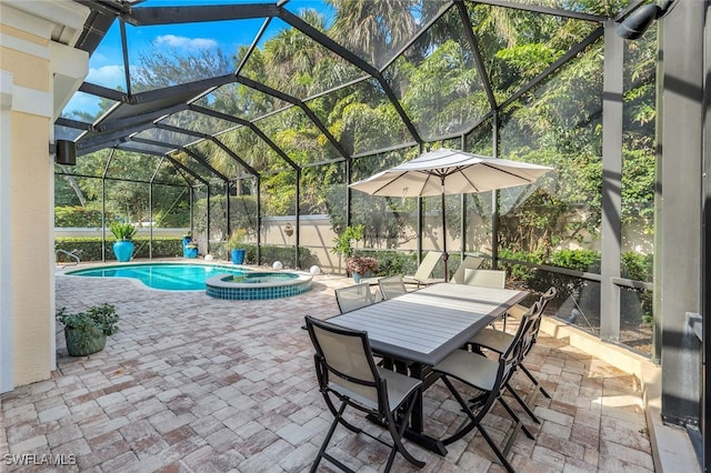 view of patio with a lanai and a pool with hot tub