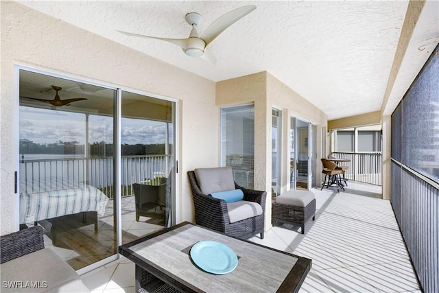 wooden terrace featuring ceiling fan